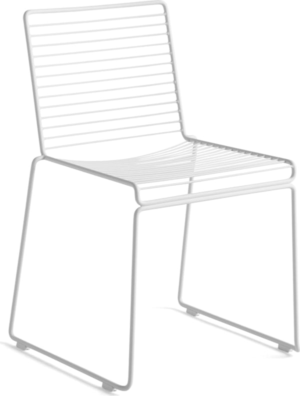 A three quarter angle view of a white Hee Dining Chair.